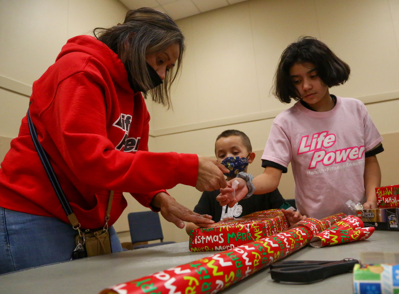 Volunteers wrap gifts for Clayton's Gift of Hope